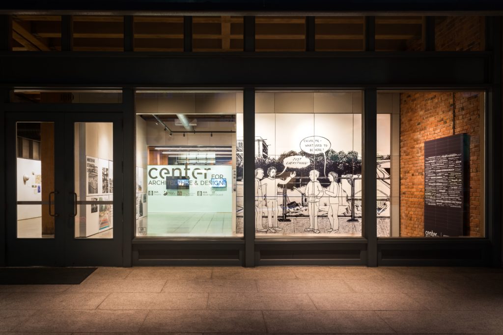 BOOM: Changing Seattle Exhibit. installation street view as seen on a dark night. Photo by Joe Freeman.